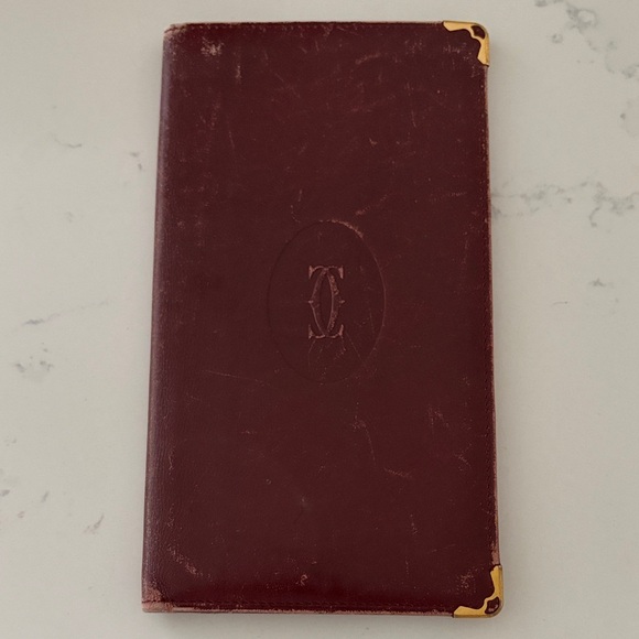 Cartier Other - Vintage Cartier Burgundy Leather planner/card holder with Gold edges long wallet